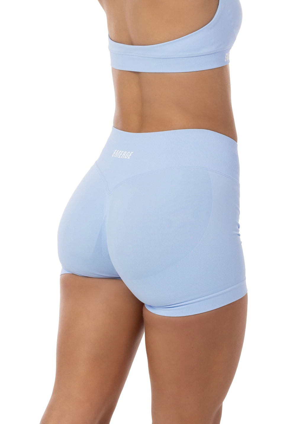 Light blue athletic shorts worn by a person on a white background